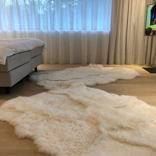 Monroe Life Knokke - schapenvachten, schapentapijten, patchwork schapenvellen op maat - Zustermerk van Oscar Candles door Marc Lendfers