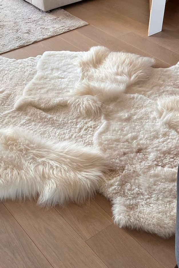 Monroe Life Knokke - schapenvachten, schapentapijten, patchwork schapenvellen op maat - Zustermerk van Oscar Candles door Marc Lendfers